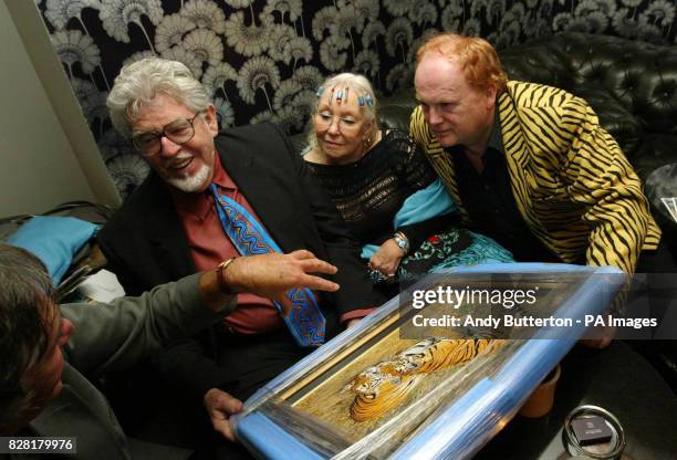 Rolf Harris with wife Alwen and Mike Batt at 'Night of the Tiger' Tuesday 18th October 2005, an Indian Restaurant celebrity curry night organised by...