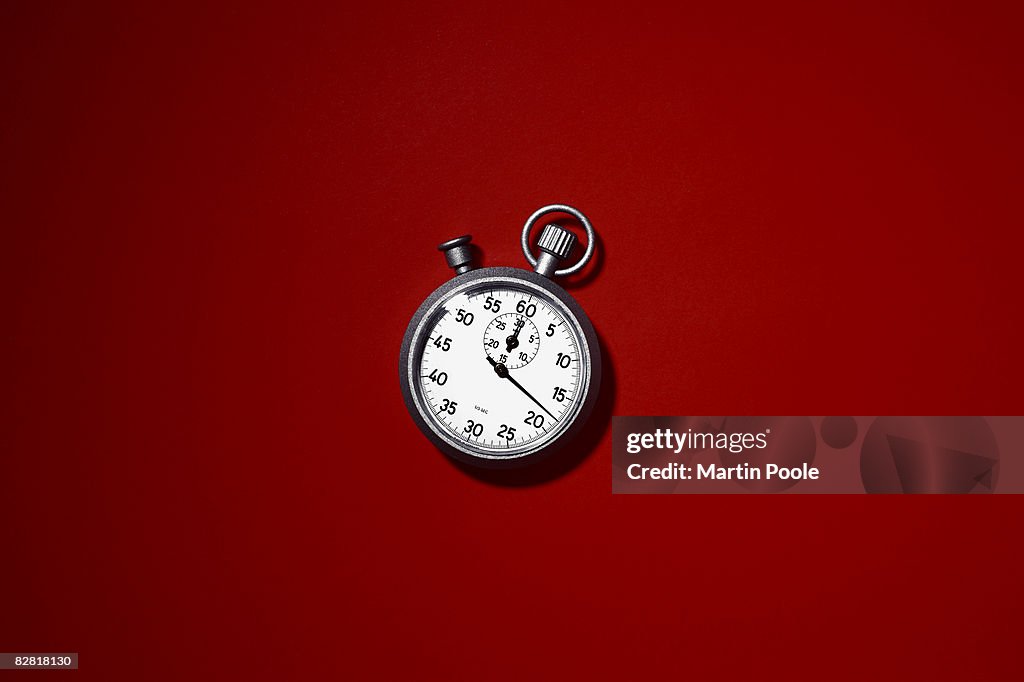 Stopwatch on red background