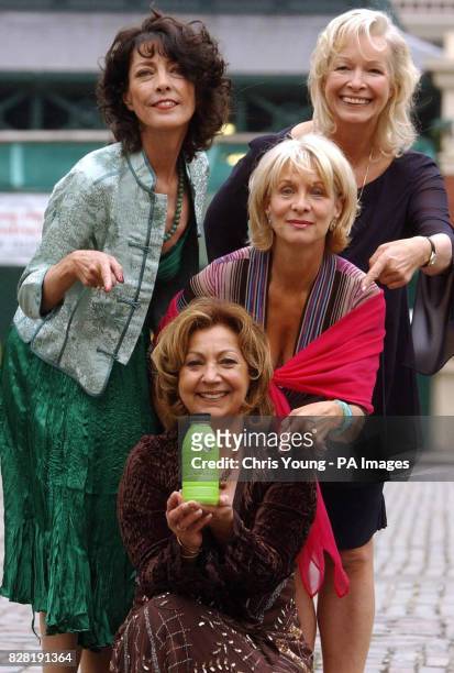Members of the 70's dance group Pan's People Louise Clarke, Babs Powell, Dee Dee Wilde and Ruth Pearson pose for photographs to launch the Complan...