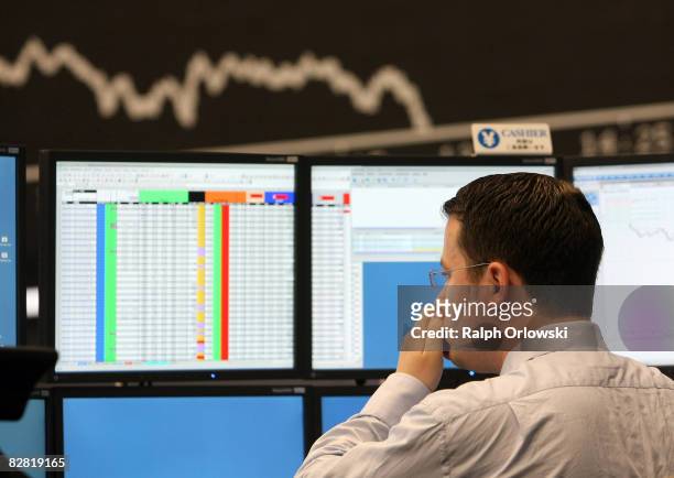 Trader rubs his nose during a trading session on the trading floor at Frankfurt stock exchange on September 15, 2008 in Frankfurt, Germany. Due to...