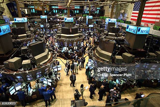 Traders work on the floor of the New York Stock Exchange September 15, 2008 in New York City. In morning trading, U.S. Stocks suffered a steep loss...