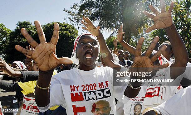 Zimbabwean opposition Movement for Democratic Change supporters celebrate the historic deal signed on September 15, 2008 by Zimbabwean leaders in...