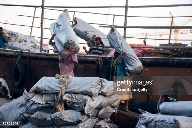 manual worker at the dubai creek - arabian sea stock pictures, royalty-free photos & images