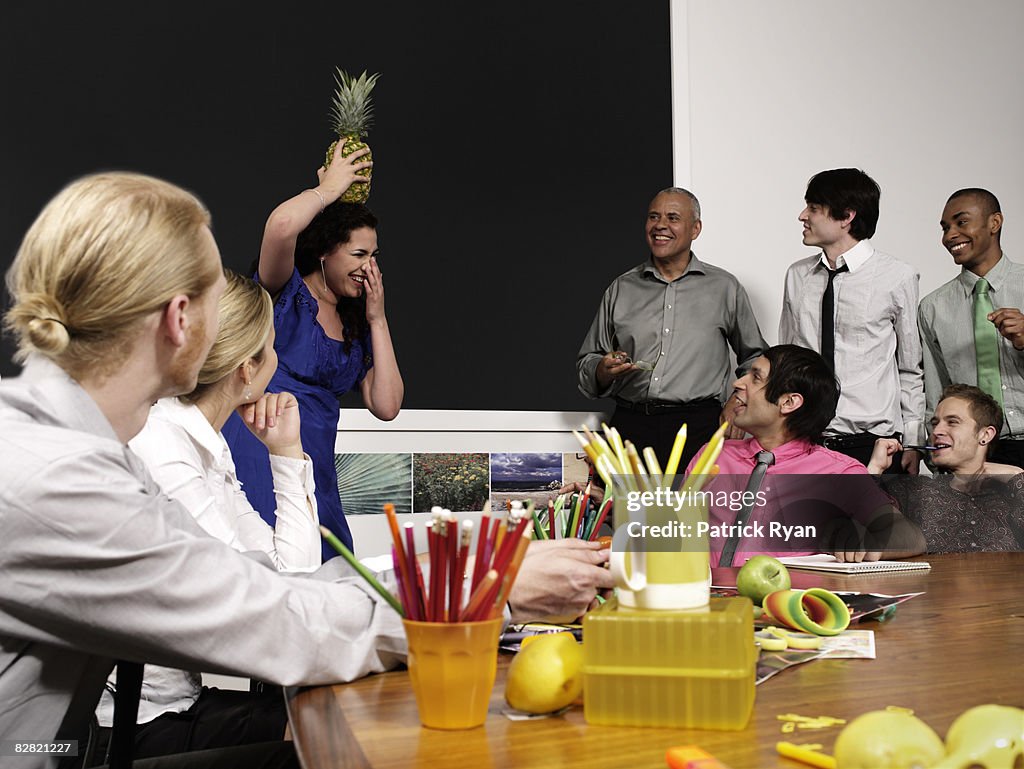 Woman balancing a pineapple on her head