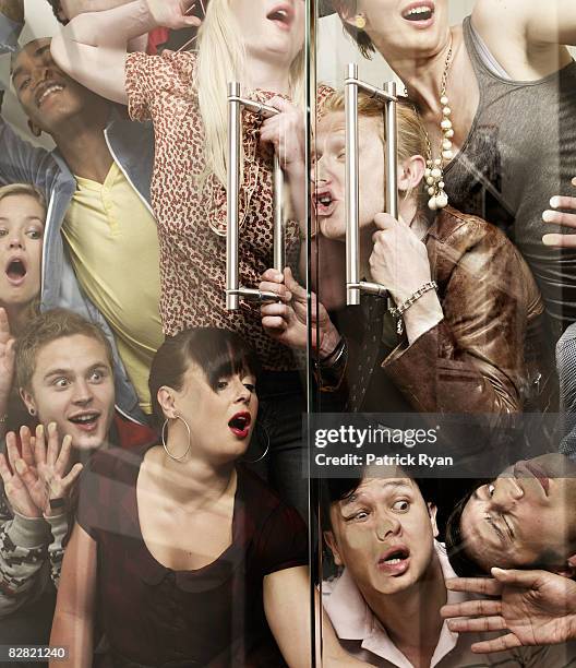 group of officemates pressing their face on glass - captivity stock pictures, royalty-free photos & images