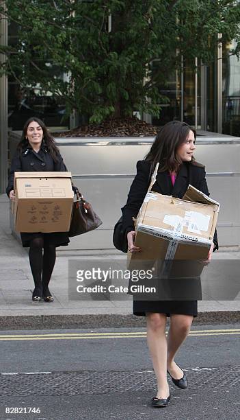 Two female employees leave Lehman Brothers' Canary Wharf office carrying belongings on September 15, 2008 in London, England. The fourth largest...