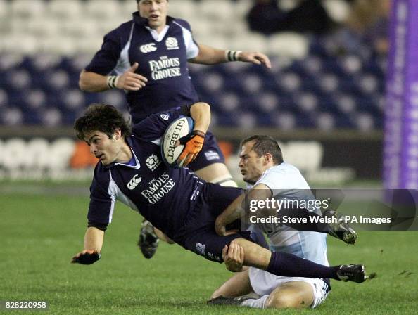 Scotland's Marcus di Rollo is tackled by Argentina's defence during ...