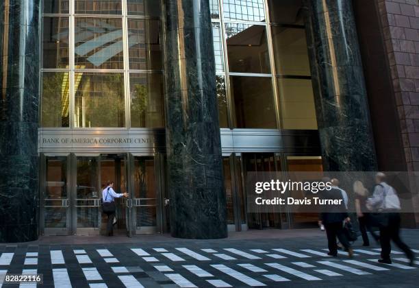 Employees enter the Bank of America headquarters at 100 N. Tryon Street on September 15, 2008 in in Charlotte, North Carolina. After withdrawing from...