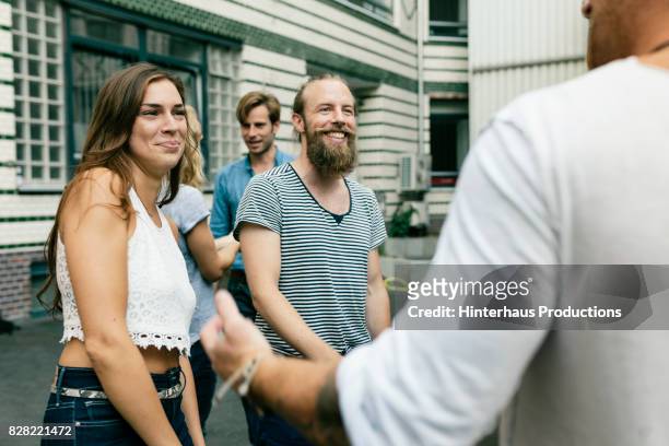 group of friends meeting for a barbecue pleased to see one another - hipster summer fun stock-fotos und bilder