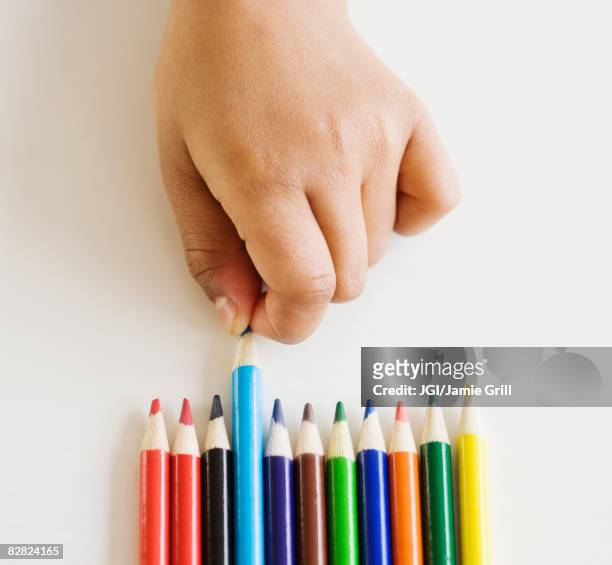 Close up of mixed race girl choosing colored pencil