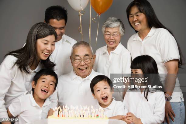 asian grandfather celebrating birthday with family - jb of south korean stockfoto's en -beelden