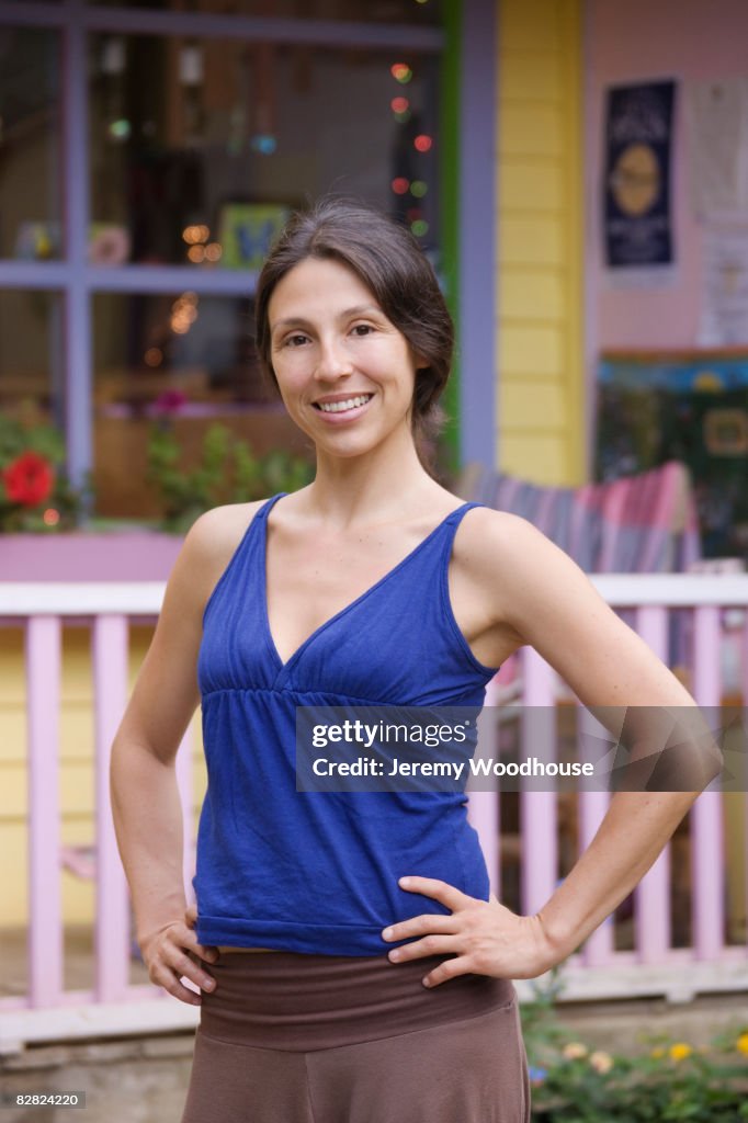 Hispanic woman with hands on hips