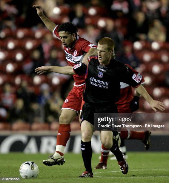 Middlesbrough's Fabio Rochemback challenges Ben Watson of Crystal Palace during the Carling Cup fourth round match at the Riverside Stadium,...