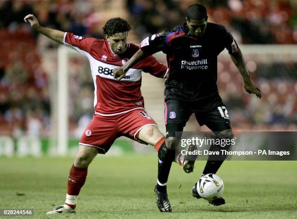 Middlesbrough's Fabio Rochemback challenges Mikele Leigertwood of Crystal Palace during the Carling Cup fourth round match at the Riverside Stadium,...