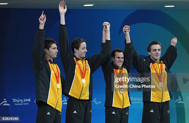 Austin Ben, Pendleton Rick, Leek Peter and Cowdrey Matthew of Australia celebrate after the Men's 4x100m Medley - 34pts Swimming Event at the...