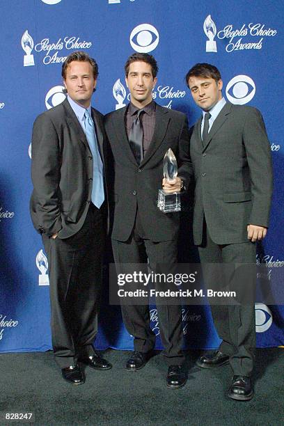 Actors Matthew Perry, David Schwimmer and Matt LaBlanc pose with their award for Favorite Television Comedy Seriesposes backstage during the 28th...