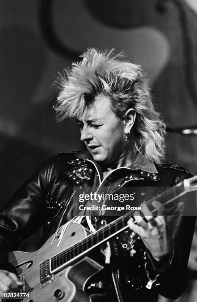 Lead singer of the rock group Stray Cats, Brian Setzer, performs during a 1987 Los Angeles, California, concert. The Stray Cats was musically a blend...