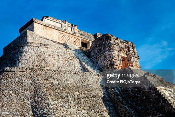 view of pyramid of the magician, uxmal, mexico - uxmal fotografías e imágenes de stock