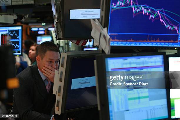 Trader works on the floor of the New York Stock Exchange September 15, 2008 in New York City. In afternoon trading the Dow Jones Industrial Average...