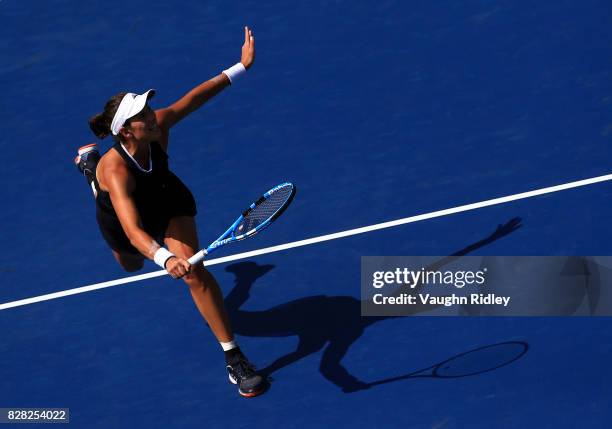 Garbine Muguruza of Spain plays a shot against Kirsten Flipkens of Belgium during Day 5 of the Rogers Cup at Aviva Centre on August 9, 2017 in...