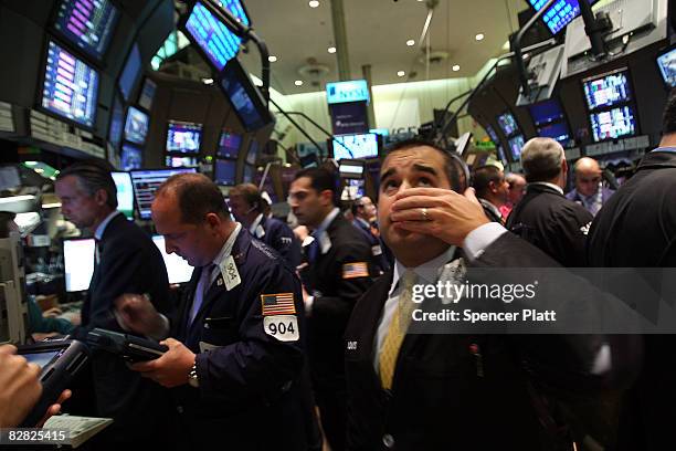 Trader works on the floor of the New York Stock Exchange September 15, 2008 in New York City. In afternoon trading the Dow Jones Industrial Average...