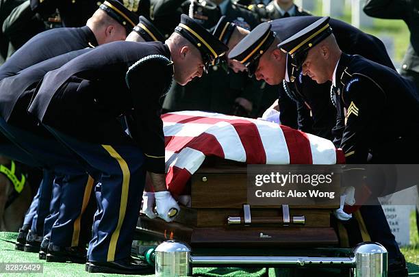 Army honor guards carry the casket of Army Sgt. 1st Class Gregory A. Rodriguez, who was assigned to the K-9 unit of the 527th Military Police Company...