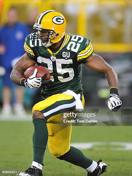 Ryan Grant of the Green Bay Packers carries the ball during an NFL game against the Minnesota Vikings at Lambeau Field, on September 8, 2008 in Green...