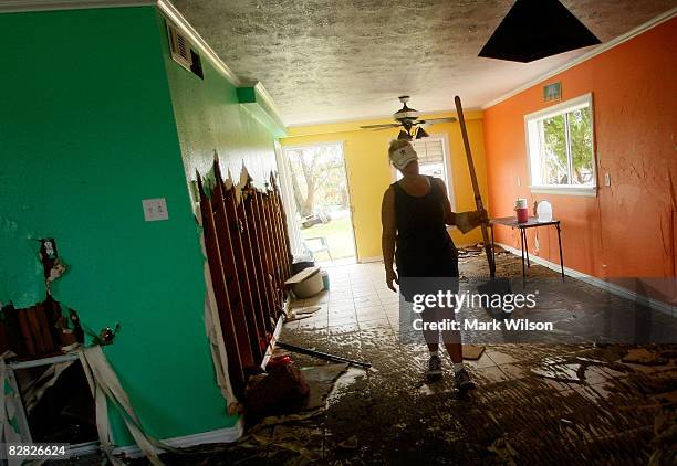 Heather Bloomfield cleans up her home that was flooded after Hurricane Ike September 15, 2008 in Galveston, Texas. Hurricane Ike caused extensive...