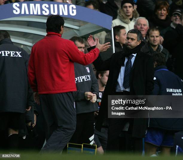 Chelsea's manager Jose Mourinho heaves a huge sigh of relief to Fulham manager Chris Coleman after a close match