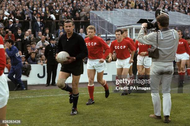 The USSR team are filmed as they run out onto the pitch before the match: goalkeeper Lev Yashin, Anatoly Banishevski, Joszef Szabo