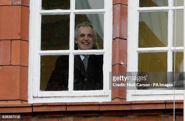 Businessman Peter Stringfellow smiles through a window in Richmond District Court as he awaits the decision on his application to secure a licence...
