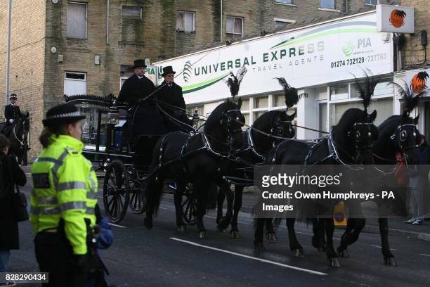 Horse-drawn carriage carries the coffin of murdered police officer Sharon Beshenivsky Wednesday January 11 after she was gunned down as she...