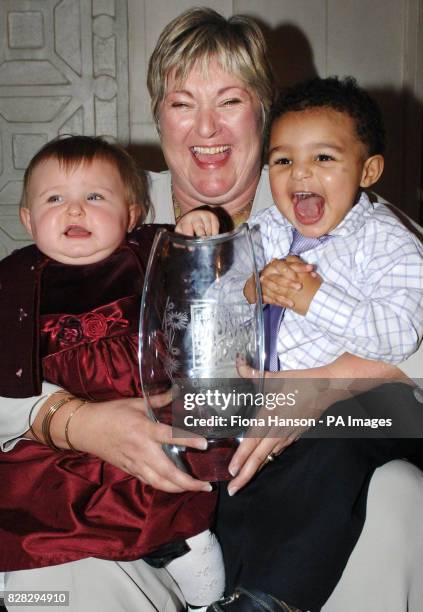 Carole Hall, 46 with her two grandchildren Brooke Burt, 8 months and Cameron Hall, 17 months after winning the Tesco Magazine inaugural Mum of the...