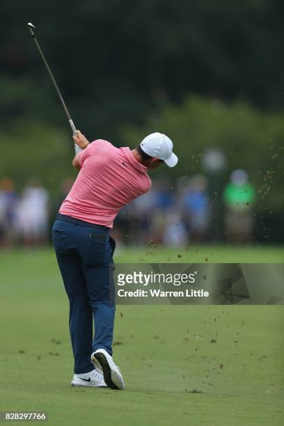 Rory McIlroy of Northern Ireland plays his second shot on the fifth hole during a practice round prior to the 2017 PGA Championship at Quail Hollow...
