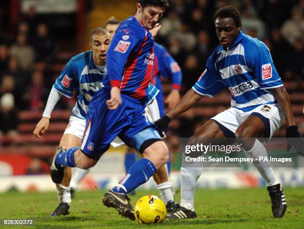 Crystal Palace's Jon Macken shoots under pressure from Reading's Ibrahima Sonko during the Coca-Cola Championship match at Selhurst Park, London,...