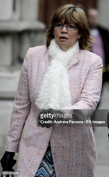 Sue Axon a divorced single parent from Baguley, Wythenshawe, leaves the High Court in London after losing a battle for a parent's "right to know" if...