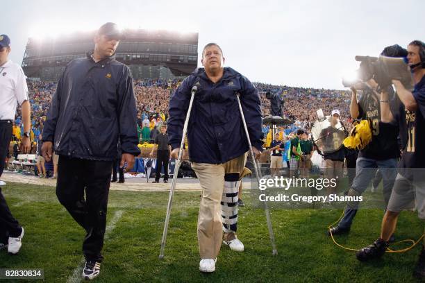 Head coach Charlie Weis of the Notre Dame Fighting Irish walks off the field after their 35-17 victory over the Michigan Wolverines on September 13,...