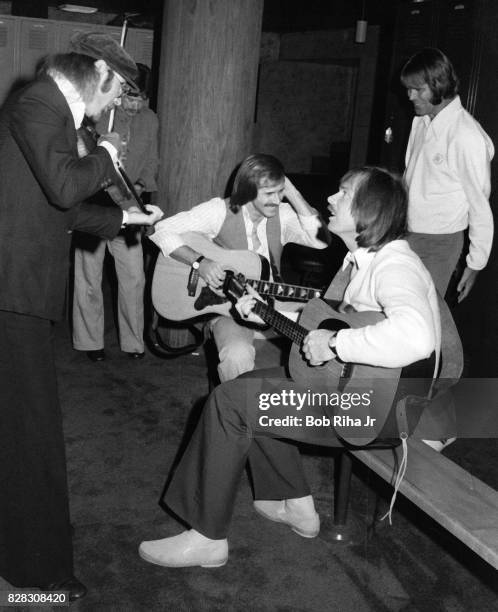 Musician Glen Campbell with Jim Seals and friends backstage prior to special evening concert at Seals & Crofts National Invitational, October 21,...