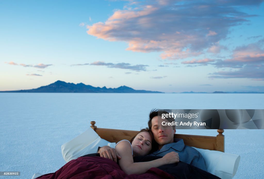 Couple Asleep in Bed in Salt Flats.