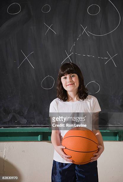 young girl holding basketball, portrait - blackboard qc stock pictures, royalty-free photos & images