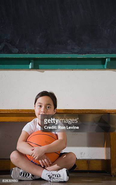 young girl sitting on gym floor  - blackboard qc stock pictures, royalty-free photos & images