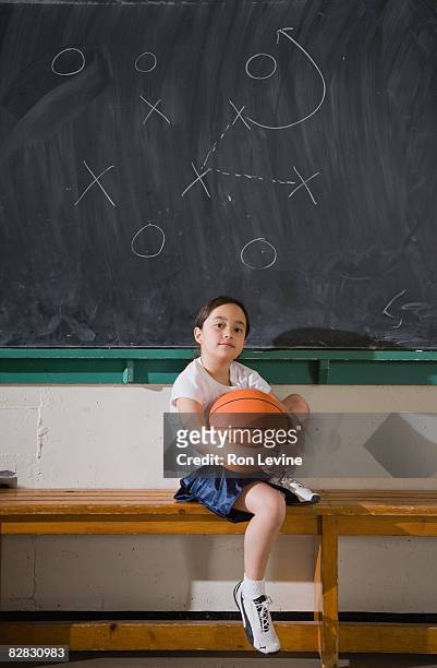 young girl sitting on bench in gym, portrait - blackboard qc stock pictures, royalty-free photos & images