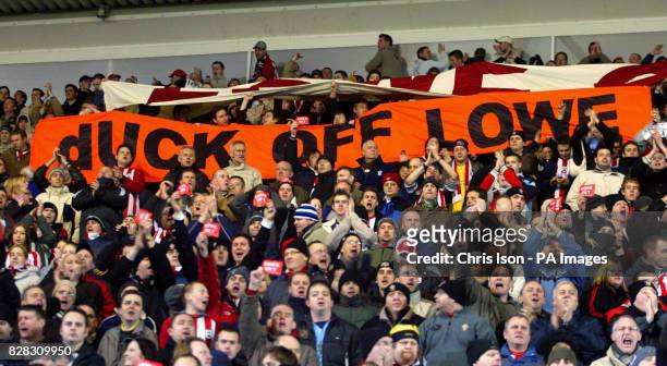 Southampton supporters hold up banners in protest at Chairman Rupert Lowe and mocking his love for duck shooting after their side's match against...