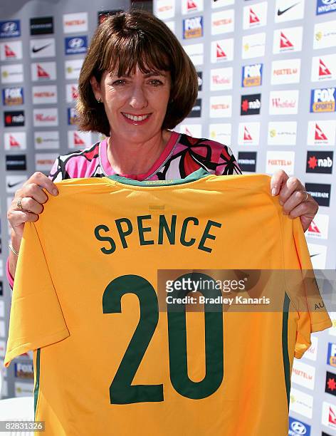 Queensland Minister for Sport & Recreation Judy Spence poses with her Socceroos jersey after an Australian Socceroos media conference announcing five...
