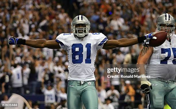 Wide receiver Terrell Owens of the Dallas Cowboys celebrates a touchdown against the Philadelphia Eagles in the second quarter at Texas Stadium on...