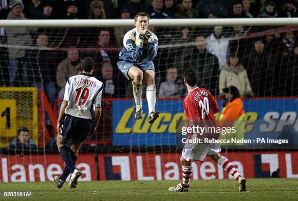 West Bromwich Albion's goalkeeper Tomasz Kuszczak claims the ball ahead of West Bromwich Albion's Curtis Davies and Charlton Athletic's Bryan Hughes