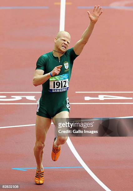 Hilton Langenhoven of South Africa celebrates winning the Men's 200m T12 at the National Stadium during day 10 of the 2008 Paralympic Games on...