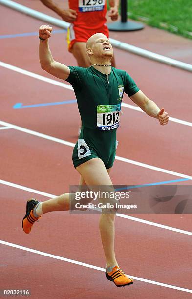 Hilton Langenhoven of South Africa celebrates winning the Men's 200m T12 at the National Stadium during day 10 of the 2008 Paralympic Games on...