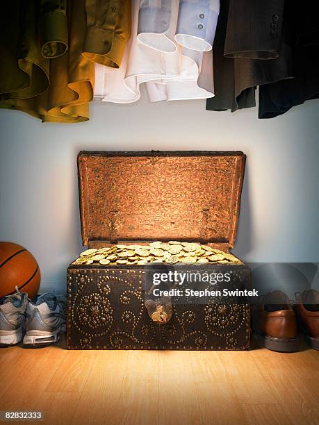 treasure chest in a closet - treasure stock-fotos und bilder