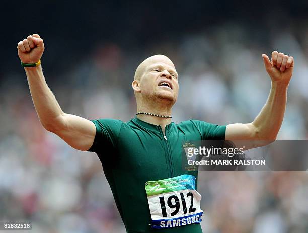 Hilton Langenhoven of South Africa celebrates after winning the final of the men's 200 metre T12 classification event at the 2008 Beijing Paralympic...